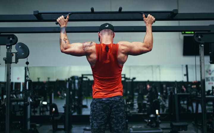 Muscular man doing pullups