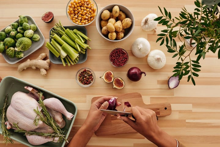A wooden table filled with healthy foods