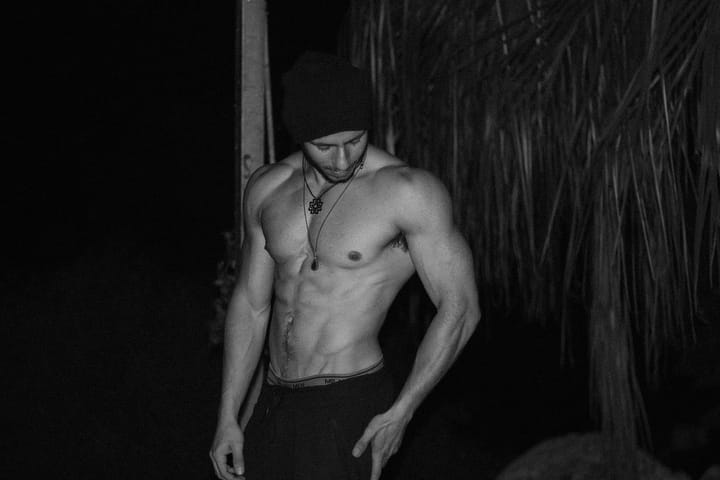 Shredded young man posing shirtless