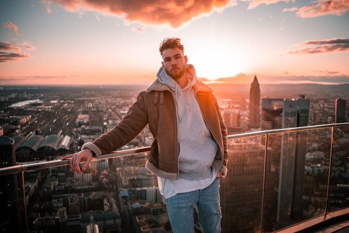 Good looking well-dressed man standing in the backdrop of a skyline